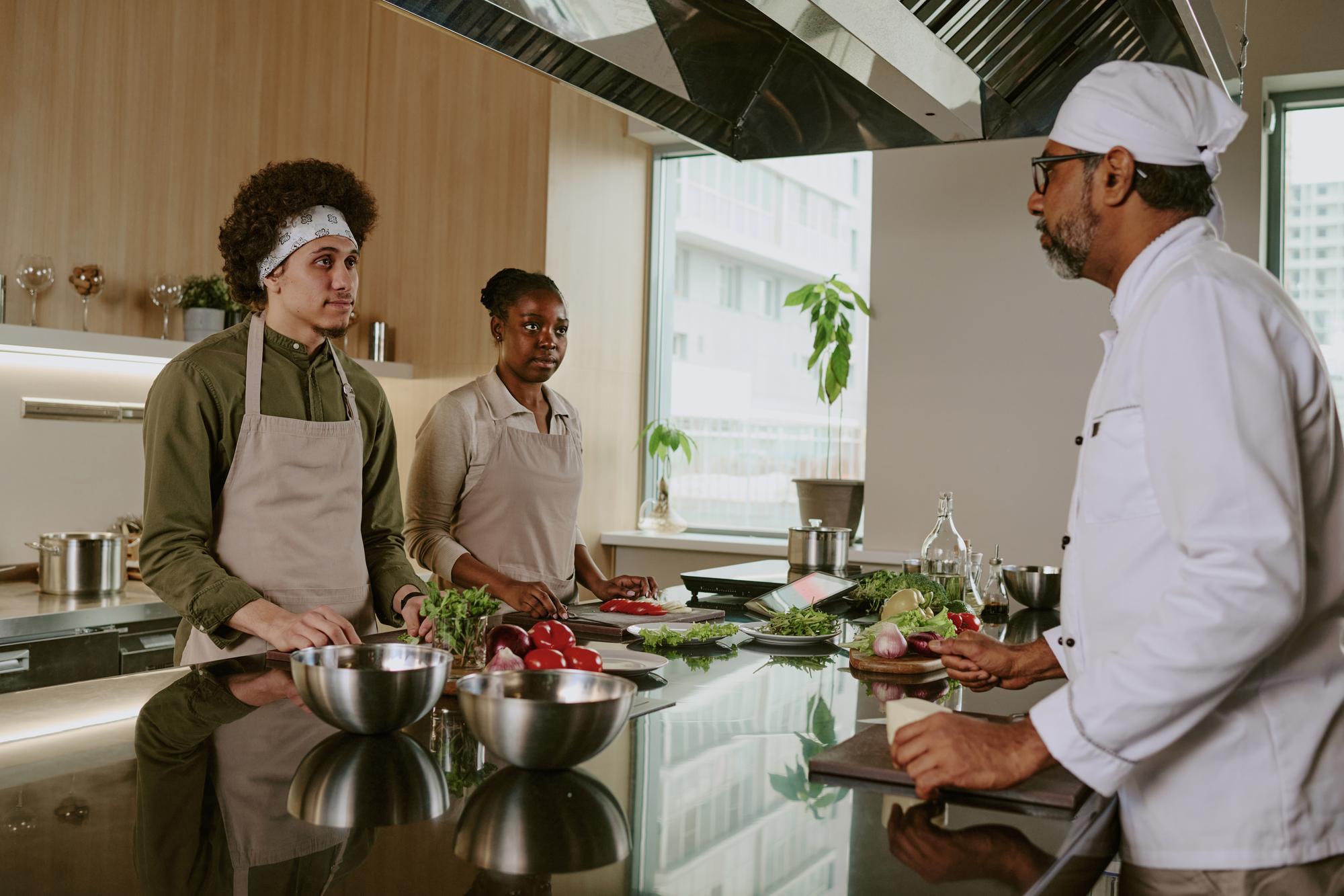 open kitchen with chefs collaborating