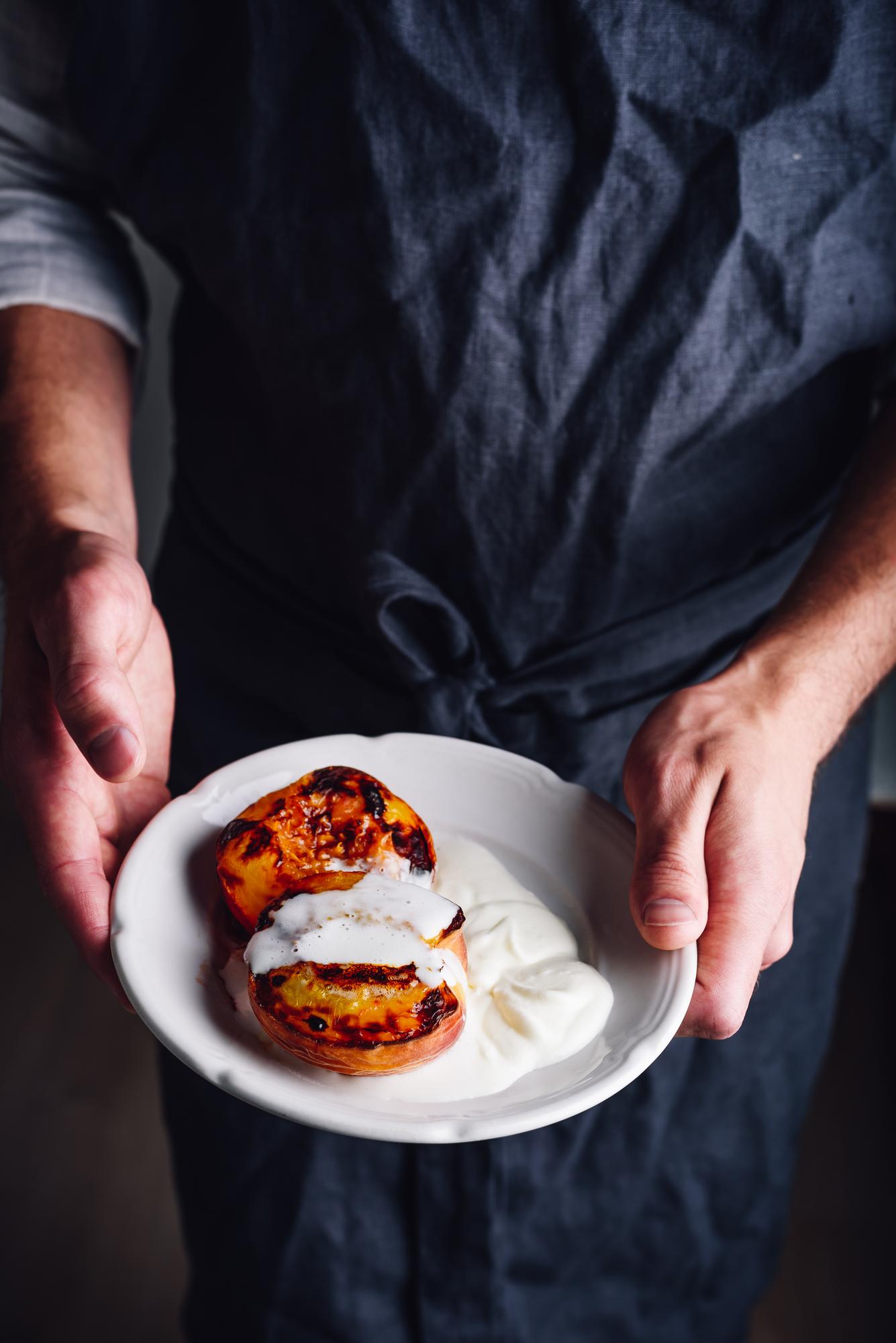 chef plating a precise modern dish